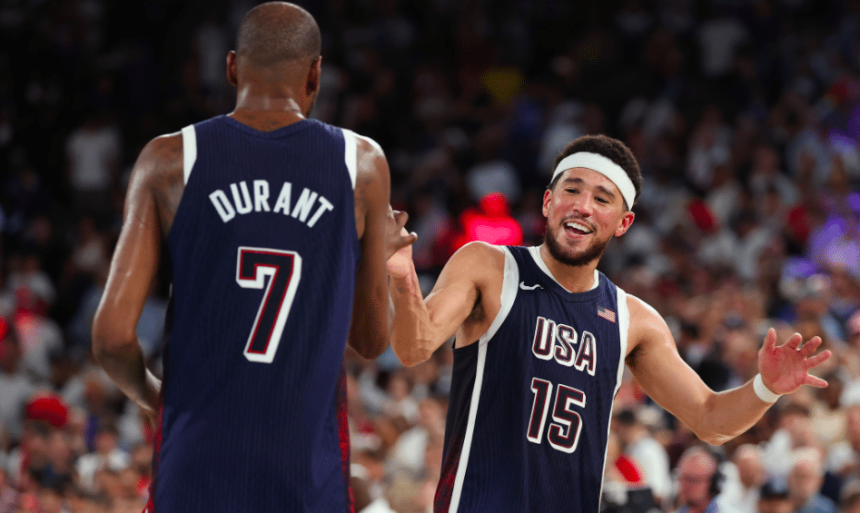 Teammates Kevin Durant (left) and Devin Booker (right) celebrate Team USA's 98-87 win over France. Photo courtesy of USA Basketball/X